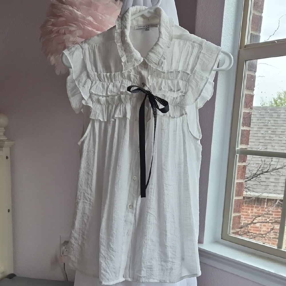 White Ruffled Sleeveless Blouse with Black Bow